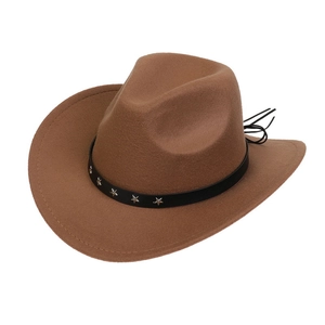 Detail of brown western cowboy hat featuring black leather band with silver star studs