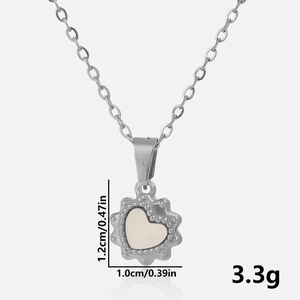 Macro view of heart pendant with measurements showing 1.2cm height and 1.0cm width