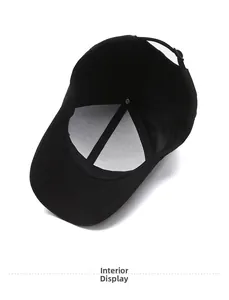 Detail view of the black baseball cap's inner lining, sweatband and metal adjustment buckle
