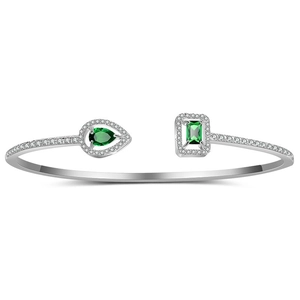 Detailed close-up of silver open cuff bracelet featuring emerald green zircon stones
