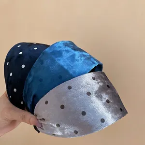 Three-piece set of wide velvet headbands with classic polka dots in navy and grey