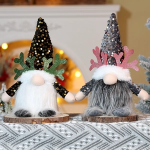 Detail of Christmas Rudolf gnomes with sequins and wooden bases for festive holiday decoration