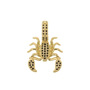 Detailed close-up of a golden scorpion pendant with embedded black stones on white background