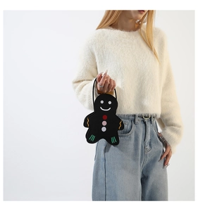 Chic gingerbread man felt handbag shown with model wearing casual white sweater