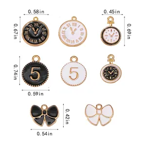 Black and white alloy watch and bow charms with precise size measurements in inches