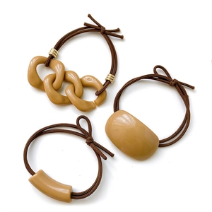 Nine-piece milk tea hair tie set with minimalist resin charms on high elastic bands