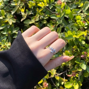 Detailed view of S925 silver leaf ring with marquise zircon on a model's hand