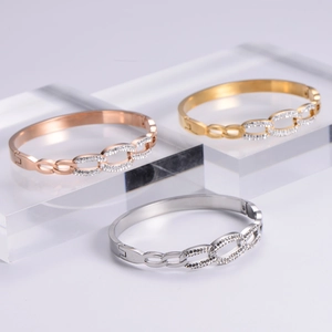 Elegant geometric gold, rose gold and silver bangle set with sparkling zircon inlays