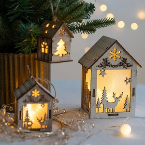 Lighted wooden Christmas house hanging ornament with reindeer and snowflake carvings