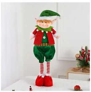 Detail of Christmas elf doll with retractable striped legs on a festive white tabletop