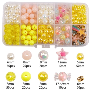 DIY jewelry making kit with various warm tone beads in a transparent plastic storage box