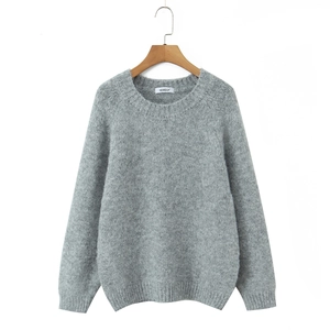 Close-up of dark grey knit sweater with ribbed crew neck and soft fuzzy texture details