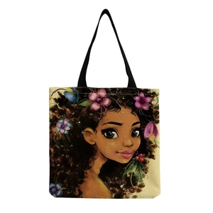 Detailed view of canvas tote bag with African woman floral art print and black straps