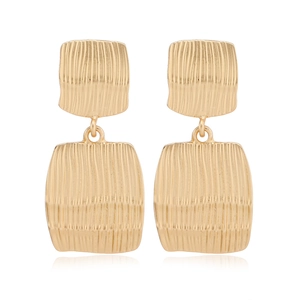 Detailed view of square matte gold earrings featuring a textured alloy surface and modern design