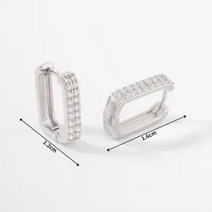 Detail of silver geometric earrings with micro-pave zircons and dimensions 1.2cm x 1.6cm