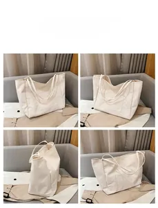 Multi-angle views of large cream canvas tote bag with front pocket and flat straps