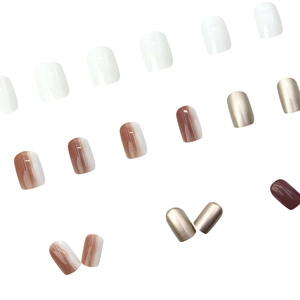 Glossy gradient press-on nails in white and brown with metallic champagne finish
