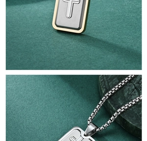 Detailed macro view of the silver rectangular pendant with golden borders on a box chain