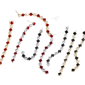 Star-shaped crystal zircon earrings with long streamline dangle design in gold and silver