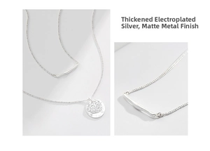 Detail of silver double layered necklace with hammer textured round pendant and metal bar