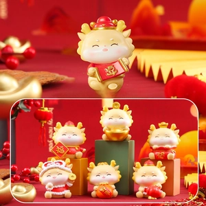 Detail of Q-version zodiac dragon figurines with traditional gold and red lucky charms