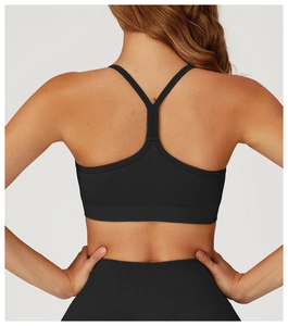 Rear view of black seamless sports bra and high-waist leggings with Y-back design