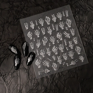 Detail of silver embossed skeleton hand nail stickers with gothic 3D metal effect