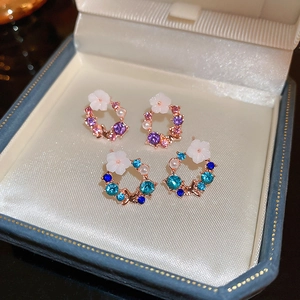 Elegant floral stud earrings with faux pearls and sparkling crystals in pink and blue