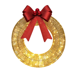 Detail of a gold wire Christmas wreath featuring a red glitter bow and warm LED lights