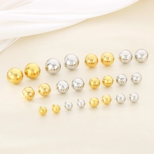 Polished gold and silver stainless steel hollow ball stud earrings in four sizes