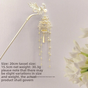 Détail du pic à cheveux phénix doré avec longs glands, longueur 20cm et poids 30,3g