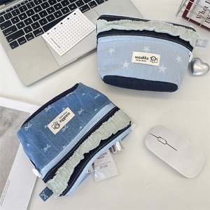 Patchwork denim cosmetic pouch with fringe trim and cute star or bow patterns