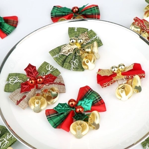 Red and green Christmas linen bows with golden bells for DIY crafts and tree decor