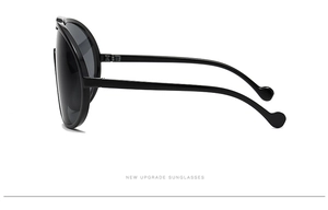 Side view of trendy oversized black frame sunglasses with smooth curved temples