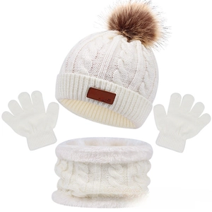 Winter set with cream knit pom-pom hat, fleece-lined neck gaiter, and gloves