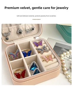 Detail view of pink travel jewelry box featuring soft velvet lining and ring dividers
