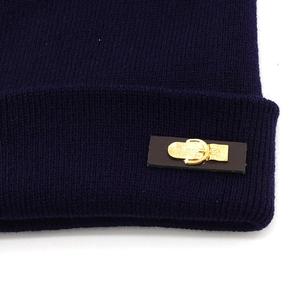 Classic dark blue knit beanie featuring a brown leather patch with a gold metal buckle