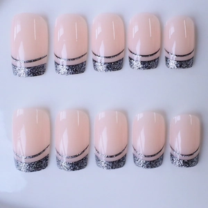 French tip press-on nails with silver glitter and black line on nude pink square nails