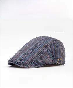 Detail of navy stripe newsboy hat featuring vintage bronze adjustable metal buckle
