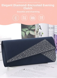 Detail of navy blue satin evening clutch with geometric folds and rhinestone accents