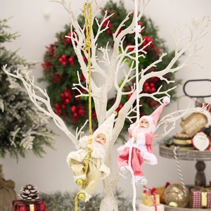 Detail of plush Santa Claus climbing rope ornaments in champagne gold and soft pink