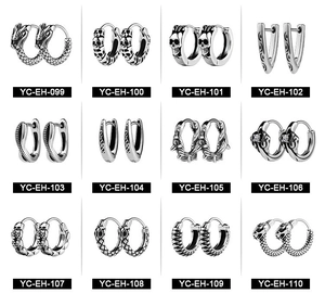 Macro display of twelve vintage skull and dragon engraved stainless steel men earrings