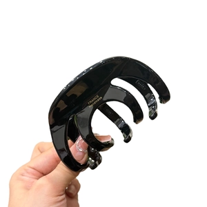 Elegant black octopus hair claw clip with golden France Handmade text and glossy finish