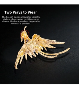 Detail of golden phoenix brooch showing dual-use pin and pendant loop mechanism