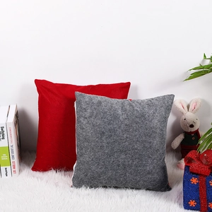 Christmas square felt pillow covers in red and grey colors on white faux fur decor