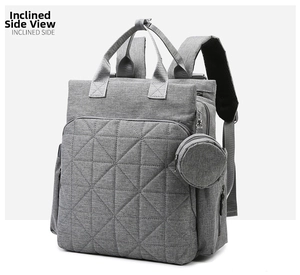 Quilted diaper backpack with round coin purse accessory showing detailed side view