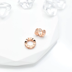 Rose gold micro-pave zircon heart spacer beads for DIY bracelets shown on white display