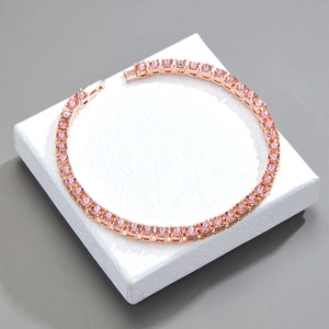 Rose gold tennis bracelet with round pink zircons and secure folding clasp