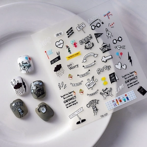 5D Christmas nail stickers with devil wings and cartoon icons on a white plate