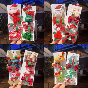 Christmas hair clip set for girls featuring festive reindeer and santa claus designs
